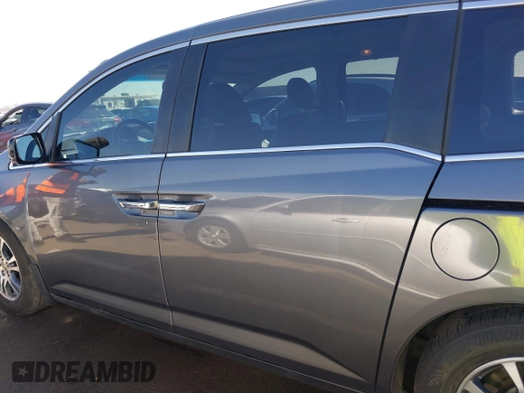 2012 Honda Odyssey EX-L with VIN 5FNRL5H64CB044075, listed as a IAAI auction lot 42094680 with 67,165 mi miles and . Bid and sale history available at carsss.com. Image 14.