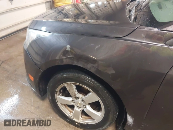 2014 Chevrolet Cruze 1LT with VIN 1G1PC5SBXE7477219, listed as a IAAI auction lot 41970786 with 194,542 mi miles and . Bid and sale history available at DreamBid. Image 15.