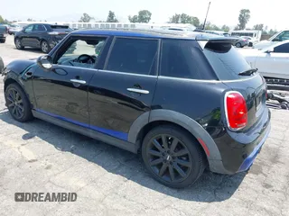 2015 MINI Hardtop 4 Door S z VIN WMWXU3C58F2B66601, wystawiony jako IAAI lot #42444404 z przebiegiem 76 174 mil mil oraz . Historia ofert i sprzedaży dostępna na DreamBid. Obrazek 3.