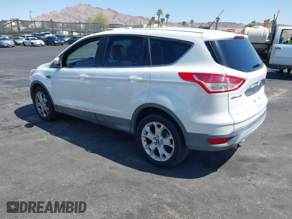 2013 Ford Escape SEL with VIN 1FMCU0HX1DUB99590, listed as a IAAI auction lot 41987910 with 129,954 mi miles. Bid and sale history available at carsss.com. Image 3.