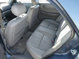 2002 Mazda 626 LX with VIN 1YVGF22D925287959, listed as a IAAI auction lot 41610932 with 122,333 mi miles. Bid and sale history available at carsss.com. Image 8.