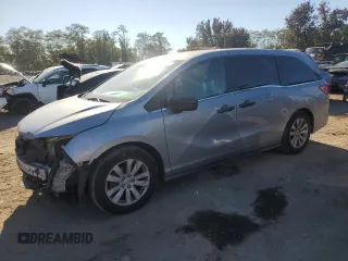 2018 Honda Odyssey LX with VIN 5FNRL6H22JB087152, listed as a Copart auction lot 76754974 with 73,057 mi miles and Salvage Title. Bid and sale history available at carsss.com. Image 1.