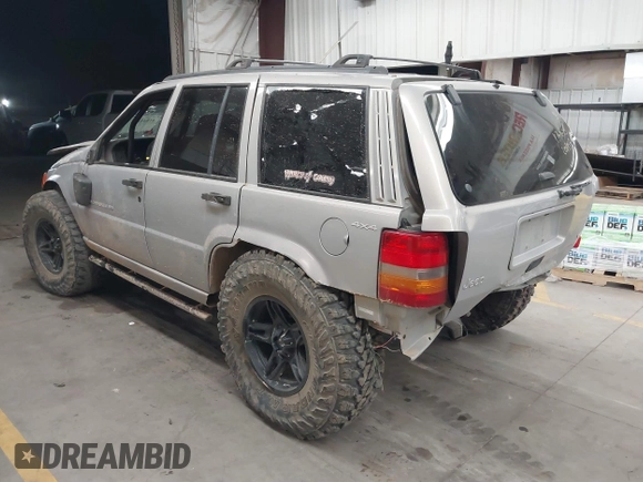 1998 Jeep Grand Cherokee Laredo with VIN 1J4GZ48Y9WC206957, listed as a IAAI auction lot 41848433 with 122,104 mi miles. Bid and sale history available at carsss.com. Image 3.