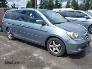2007 Honda Odyssey Touring z VIN 5FNRL38857B015387, wystawiony jako IAAI lot #42358439 z przebiegiem 259 533 mil mil oraz . Historia ofert i sprzedaży dostępna na DreamBid. Obrazek 1.