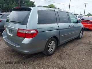 2005 Honda Odyssey EX with VIN 5FNRL38415B104920, listed as a IAAI auction lot 42094690 with 228,538 mi miles. Bid and sale history available at carsss.com. Image 4.