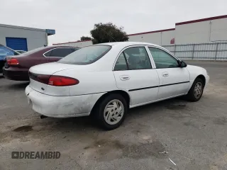 1999 Ford Escort LX with VIN 1FAFP10P7XW221648, listed as a Copart auction lot 71844334 with 140,899 mi miles and Salvage Title. Bid and sale history available at carsss.com. Image 3.