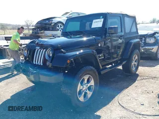 2016 Jeep Wrangler Sahara with VIN 1C4AJWBG0GL174481, listed as a IAAI auction lot 41868149 with 59,300 mi miles and . Bid and sale history available at DreamBid. Image 2.