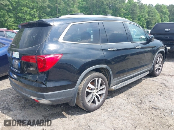 2017 Honda Pilot Touring with VIN 5FNYF5H99HB037126, listed as a IAAI auction lot 42275048 with 164,289 mi miles and . Bid and sale history available at DreamBid. Image 4.