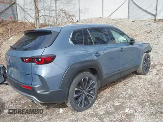 2023 Mazda CX-50 2.5 Turbo Premium Plus Package with VIN 7MMVABEY1PN101123, listed as a IAAI auction lot 41858602 with 34,541 mi miles. Bid and sale history available at carsss.com. Image 4.