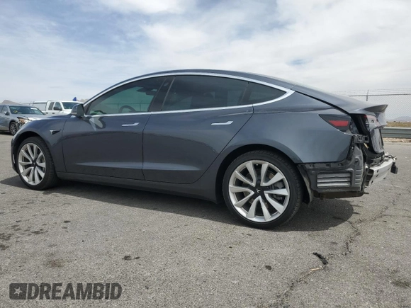 2019 Tesla Model 3 Mid Range z VIN 5YJ3E1EA2KF417212, wystawiony jako Copart lot #50968615 z przebiegiem 104 807 mil mil oraz Szkody całkowita. Historia ofert i sprzedaży dostępna na DreamBid. Obrazek 2.