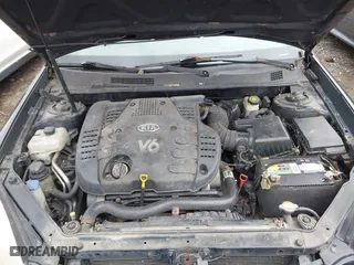 2007 Kia Optima LX with VIN KNAGE124975133923, listed as a IAAI auction lot 42007990 with 87,768 mi miles. Bid and sale history available at carsss.com. Image 10.