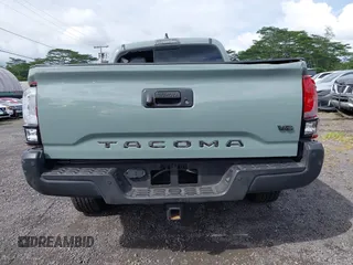 2023 Toyota Tacoma SR5 z VIN 3TYDZ5BNXPT024914, wystawiony jako IAAI lot #41302756 z przebiegiem 20 307 mil mil oraz . Historia ofert i sprzedaży dostępna na DreamBid. Obrazek 17.