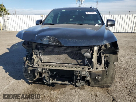 2023 Chevrolet Suburban LT with VIN 1GNSCCKD1PR124986, listed as a Copart auction lot 87432904 with 105,026 mi miles and Salvage Title. Bid and sale history available at DreamBid. Image 5.