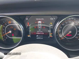 2021 Jeep Wrangler Unlimited Freedom z VIN 1C4HJXDN2MW544730, wystawiony jako IAAI lot #42624402 z przebiegiem 60 993 mil mil oraz . Historia ofert i sprzedaży dostępna na DreamBid. Obrazek 7.