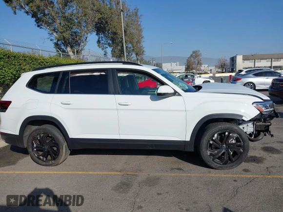 2023 Volkswagen Atlas SE z VIN 1V2WP2CA6PC533984, wystawiony jako IAAI lot #41021512 z przebiegiem 26 993 mil mil oraz . Historia ofert i sprzedaży dostępna na DreamBid. Obrazek 13.