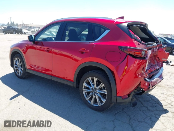 2021 Mazda CX-5 Grand Touring with VIN JM3KFADM5M0470483, listed as a IAAI auction lot 42785031 with 30,749 mi miles and . Bid and sale history available at DreamBid. Image 3.