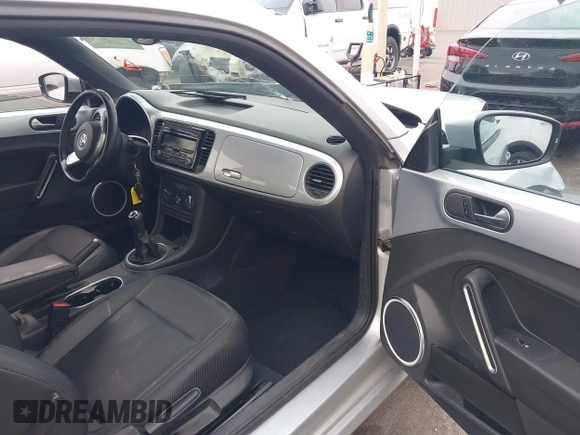 2013 Volkswagen Beetle with VIN 3VWHX7ATXDM658134, listed as a IAAI auction lot 42097779 with 47,901 mi miles and . Bid and sale history available at DreamBid. Image 5.