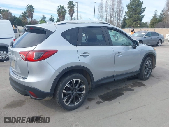 2016 Mazda CX-5 Grand Touring with VIN JM3KE2DY9G0723921, listed as a IAAI auction lot 41681522 with 83,893 mi miles. Bid and sale history available at carsss.com. Image 4.