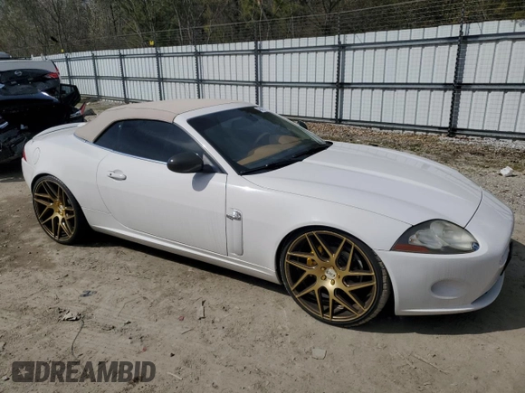 2007 Jaguar XK with VIN SAJDA44B775B05606, listed as a Copart auction lot 49419515 with 115,607 mi miles and Salvage Title. Bid and sale history available at DreamBid. Image 4.