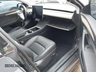 2023 Tesla Model Y Performance z VIN 7SAYGDEF1PF925274, wystawiony jako IAAI lot #42078813 z przebiegiem 20 422 mil mil oraz . Historia ofert i sprzedaży dostępna na DreamBid. Obrazek 5.