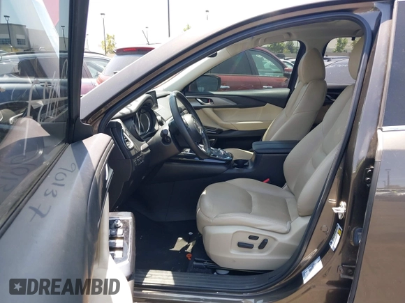 2017 Mazda CX-9 Touring with VIN JM3TCBCY1H0131233, listed as a IAAI auction lot 42490137 with 84,216 mi miles and . Bid and sale history available at DreamBid. Image 5.