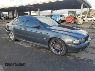 2000 BMW 5 Series 540i with VIN WBADN5348YGC95477, listed as a Copart auction lot 87242764 with 135,424 mi miles and Salvage Title. Bid and sale history available at carsss.com. Image 4.