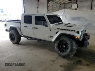 2020 Jeep Gladiator Rubicon z VIN 1C6JJTBG4LL102523, wystawiony jako Copart lot #54735955 z przebiegiem 104 579 mil mil oraz Szkoda całkowita • Salvage title. Historia ofert i sprzedaży dostępna na DreamBid. Obrazek 4.