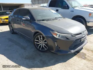 2014 Scion tC with VIN JTKJF5C74E3085237, listed as a IAAI auction lot 41788862 with 106,807 mi miles. Bid and sale history available at carsss.com. Image 1.