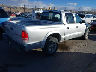 2004 Dodge Dakota Sport with VIN 1D7HL38K84S713231, listed as a IAAI auction lot 41371750 with 269,415 mi miles. Bid and sale history available at carsss.com. Image 4.