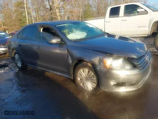 2015 Volkswagen Passat 1.8T S with VIN 1VWAT7A30FC018547, listed as a IAAI auction lot 41304925 with 76,384 mi miles. Bid and sale history available at carsss.com. Image 1.