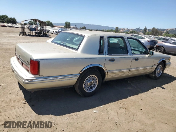 1997 Lincoln Town Car Executive with VIN 1LNLM81W8VY734974, listed as a Copart auction lot 61440195 with 94,982 mi miles and Clean title. Bid and sale history available at DreamBid. Image 3.