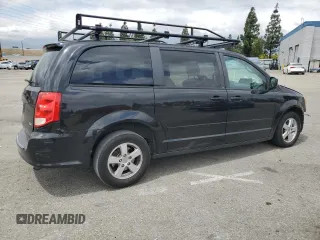2013 Dodge Grand Caravan SXT with VIN 2C4RDGCGXDR581399, listed as a Copart auction lot 54787935 with 162,970 mi miles and Salvage Title. Bid and sale history available at DreamBid. Image 3.