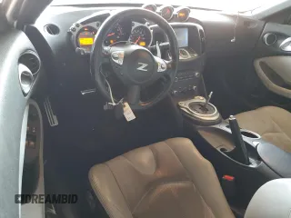2012 Nissan 370Z Touring with VIN JN1AZ4EH9CM564312, listed as a Copart auction lot 52127525 with 134,465 mi miles and Salvage Title. Bid and sale history available at carsss.com. Image 8.