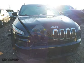 2015 Jeep Cherokee Latitude with VIN 1C4PJMCS0FW512153, listed as a IAAI auction lot 41649376 with 147,910 mi miles. Bid and sale history available at carsss.com. Image 6.