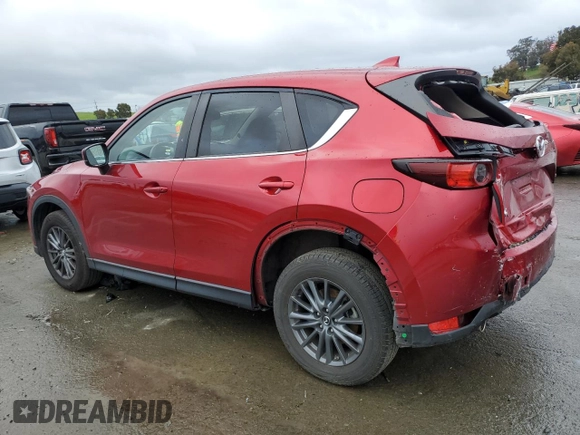 2021 Mazda CX-5 Touring with VIN JM3KFACM8M0406987, listed as a Copart auction lot 45241535 with 57,673 mi miles and Salvage Title. Bid and sale history available at carsss.com. Image 2.