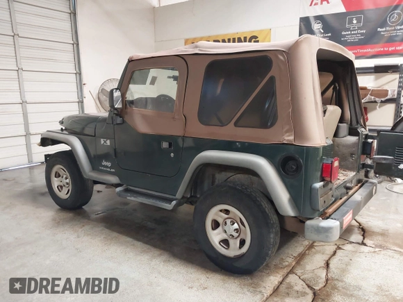 2003 Jeep Wrangler X z VIN 1J4FA39S43P339234, wystawiony jako IAAI lot #41329654 z przebiegiem 175 376 mil mil oraz . Historia ofert i sprzedaży dostępna na DreamBid. Obrazek 3.