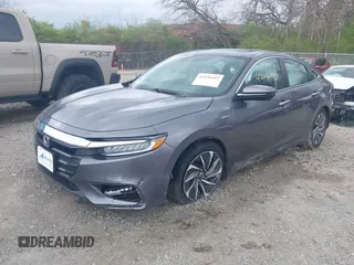 2021 Honda Insight Touring with VIN 19XZE4F91ME005517, listed as a IAAI auction lot 42036493 with 65,404 mi miles and . Bid and sale history available at carsss.com. Image 2.