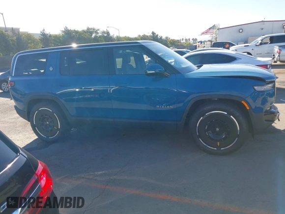 2025 Rivian R1S Adventure with VIN 7PDSGBBA9SN056202, listed as a IAAI auction lot 40766927 with 1,688 mi miles. Bid and sale history available at carsss.com. Image 13.