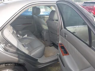 2005 Toyota Camry LE z VIN 4T1BF32K85U594470, wystawiony jako IAAI lot #42280442 z przebiegiem 151 553 mil mil oraz . Historia ofert i sprzedaży dostępna na DreamBid. Obrazek 8.