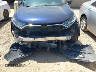 2020 Honda CR-V LX with VIN 2HKRW1H22LH412512, listed as a IAAI auction lot 42107381 with 60,062 mi miles and . Bid and sale history available at DreamBid. Image 6.