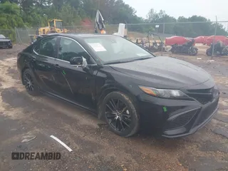 2023 Toyota Camry SE with VIN 4T1G11AKXPU827360, listed as a IAAI auction lot 42217356 with 57,497 mi miles and . Bid and sale history available at DreamBid. Image 1.