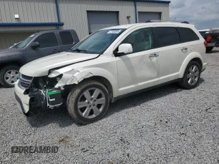 2013 Dodge Journey Crew with VIN 3C4PDCDG9DT599243, listed as a Copart auction lot 57165095 with 213,592 mi miles and Salvage title. Bid and sale history available at DreamBid. Image 1.