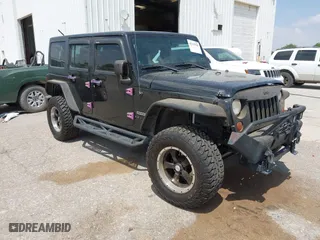 2013 Jeep Wrangler Unlimited Sport with VIN 1C4BJWDG9DL569109, listed as a IAAI auction lot 42115703 with 120,803 mi miles. Bid and sale history available at carsss.com. Image 1.