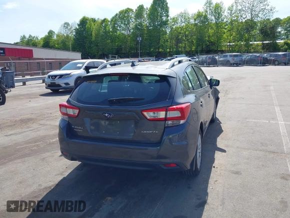 2018 Subaru Impreza Premium with VIN 4S3GTAD60J3705407, listed as a IAAI auction lot 42109867 with 74,014 mi miles and . Bid and sale history available at DreamBid. Image 4.