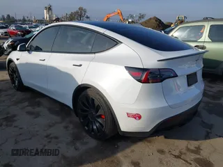 2023 Tesla Model Y Performance with VIN 7SAYGDEF0PF839468, listed as a IAAI auction lot 41609263 with 25,434 mi miles and . Bid and sale history available at DreamBid. Image 3.