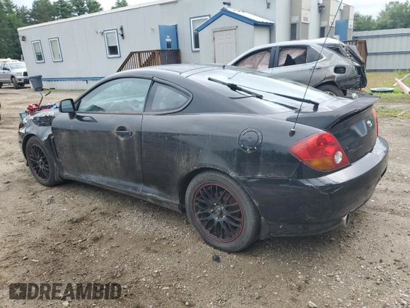 2003 Hyundai Tiburon GT z VIN KMHHN65F83U101784, wystawiony jako Copart lot #41566805 z przebiegiem 99 970 mil mil oraz Nie do naprawy • Non repairable. Historia ofert i sprzedaży dostępna na DreamBid. Obrazek 2.