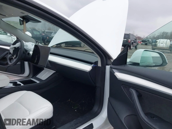 2022 Tesla Model 3 Long Range with VIN 5YJ3E1EB6NF272009, listed as a IAAI auction lot 41984154 with 12,651 mi miles and . Bid and sale history available at DreamBid. Image 5.