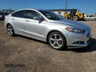 2013 Ford Fusion SE Hybrid z VIN 3FA6P0LU8DR325849, wystawiony jako Copart lot #53520515 z przebiegiem 93 615 mil mil oraz Czysty tytuł • Clean title. Historia ofert i sprzedaży dostępna na DreamBid. Obrazek 4.