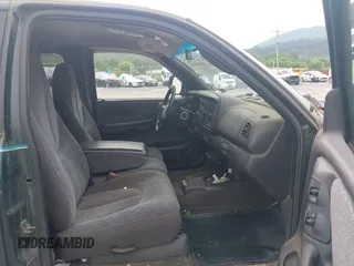 1999 Dodge Dakota SLT z VIN 1B7GG22X0XS104969, wystawiony jako IAAI lot #42493470 z przebiegiem 160 019 mil mil oraz . Historia ofert i sprzedaży dostępna na DreamBid. Obrazek 5.