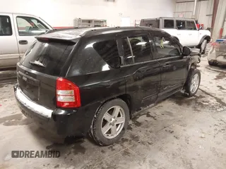 2010 Jeep Compass Sport with VIN 1J4NF4FB0AD501897, listed as a IAAI auction lot 41570009 with 198,376 mi miles. Bid and sale history available at carsss.com. Image 4.